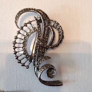 Beautiful faux silver brooch.